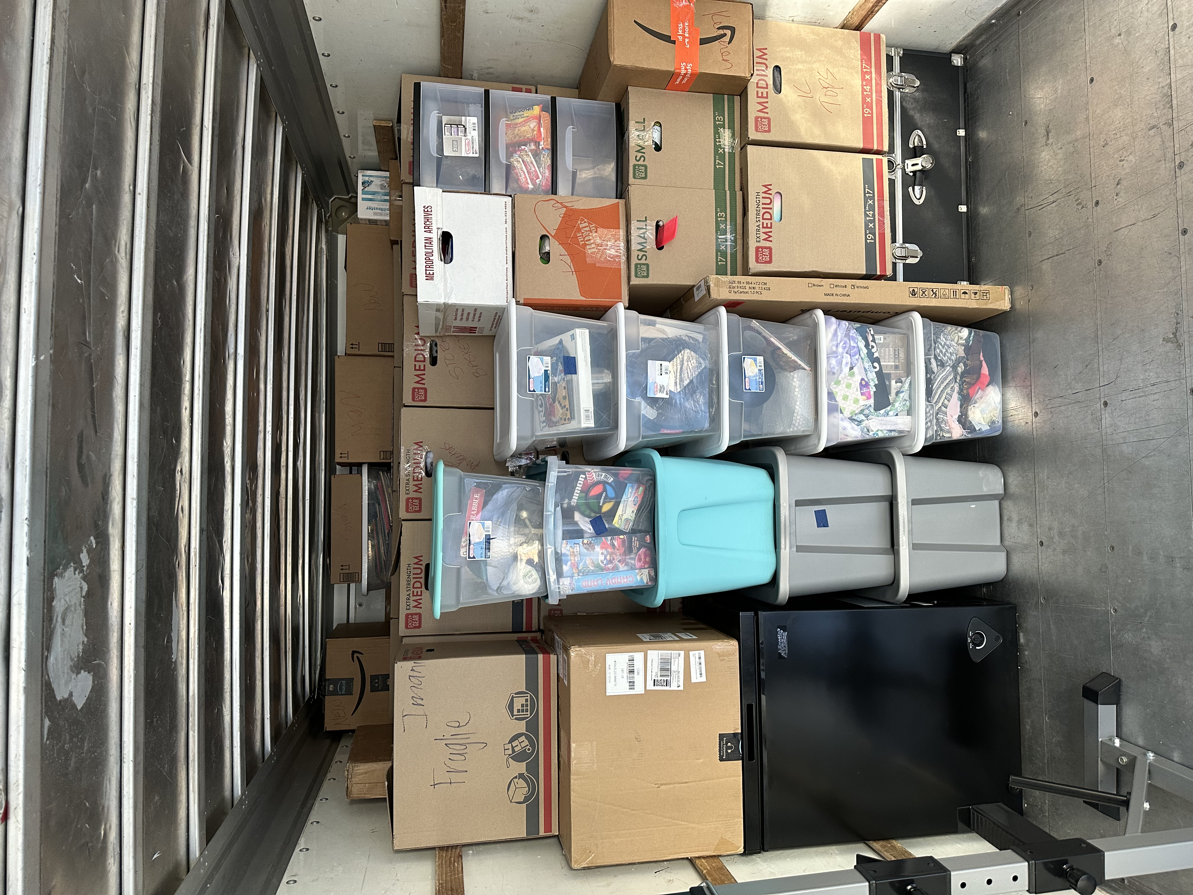 Bins, totes, and boxes stacked in organized layers