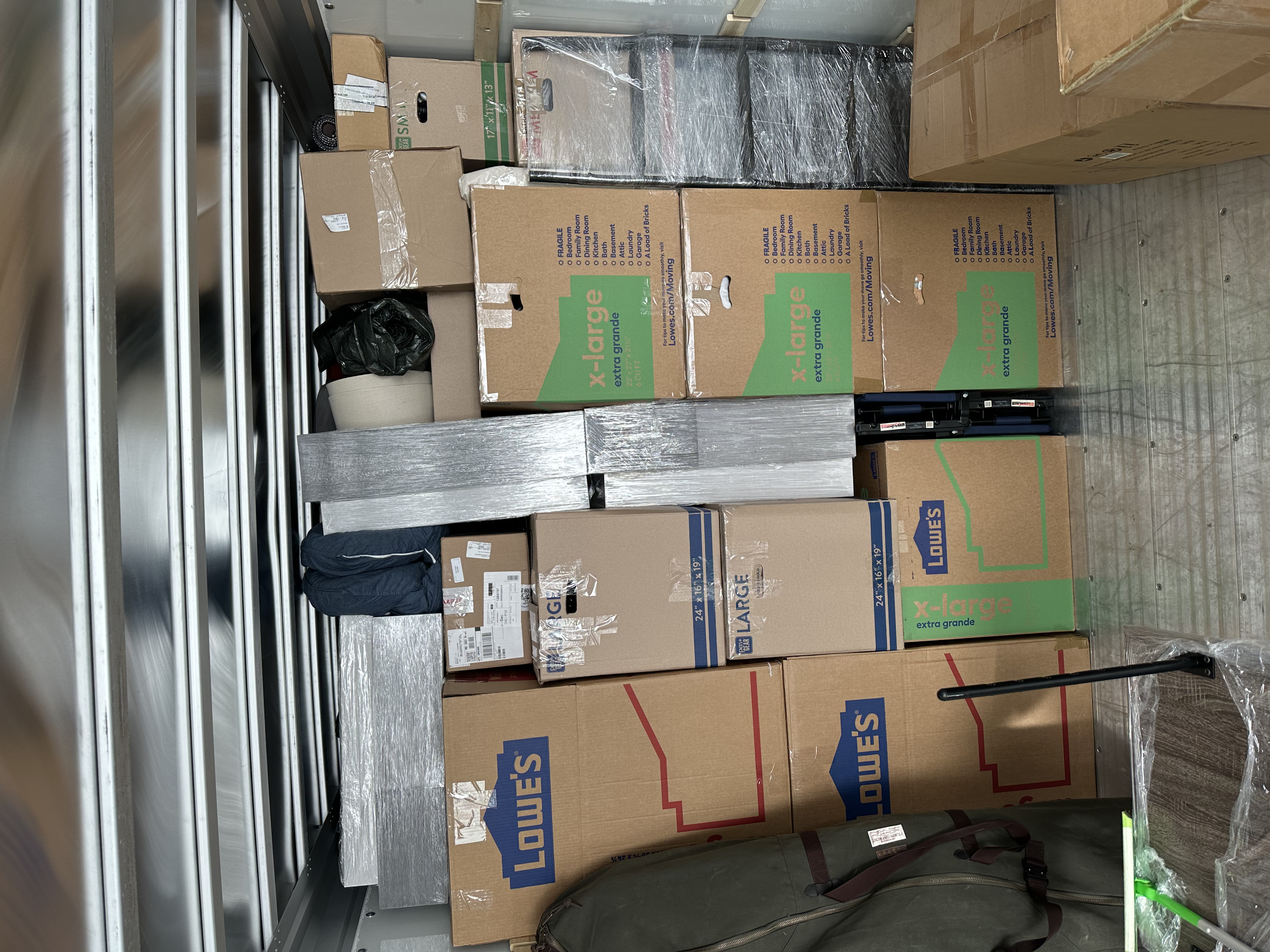 Boxes stacked to the ceiling — tight pack