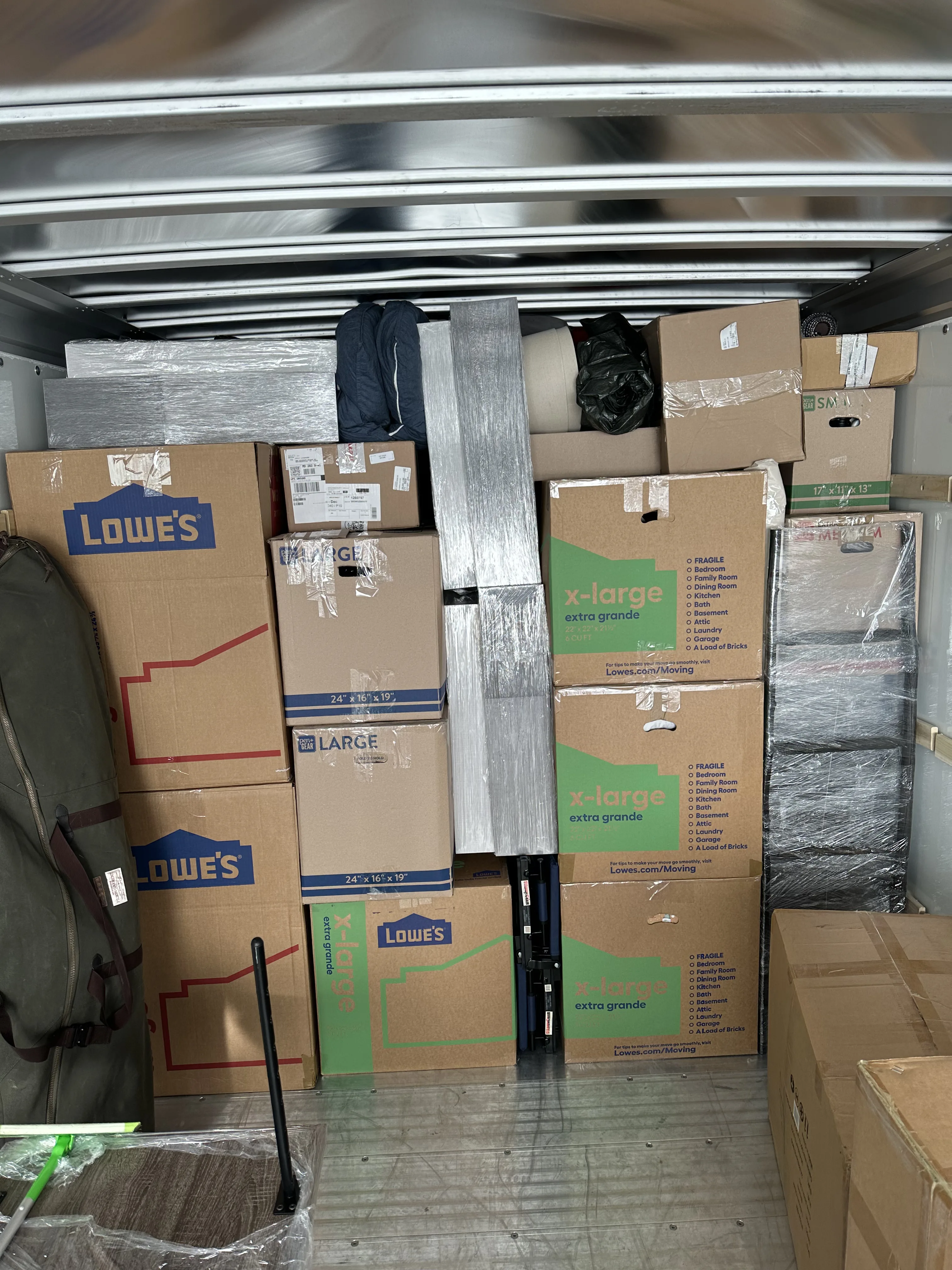 Boxes stacked to the ceiling — tight pack