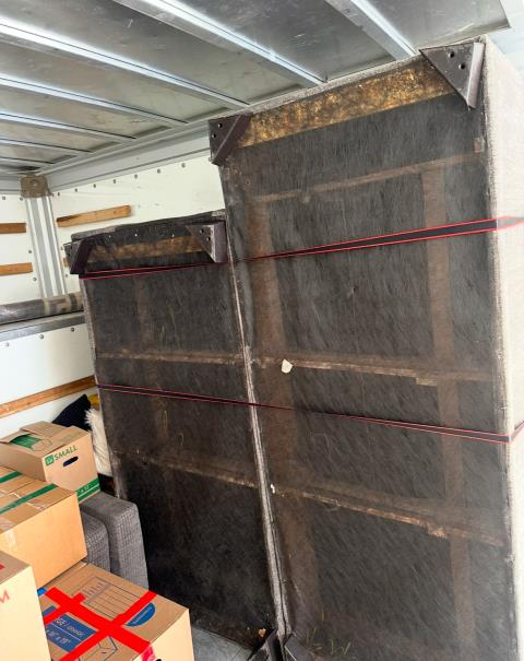 Furniture pad-wrapped and strapped in truck