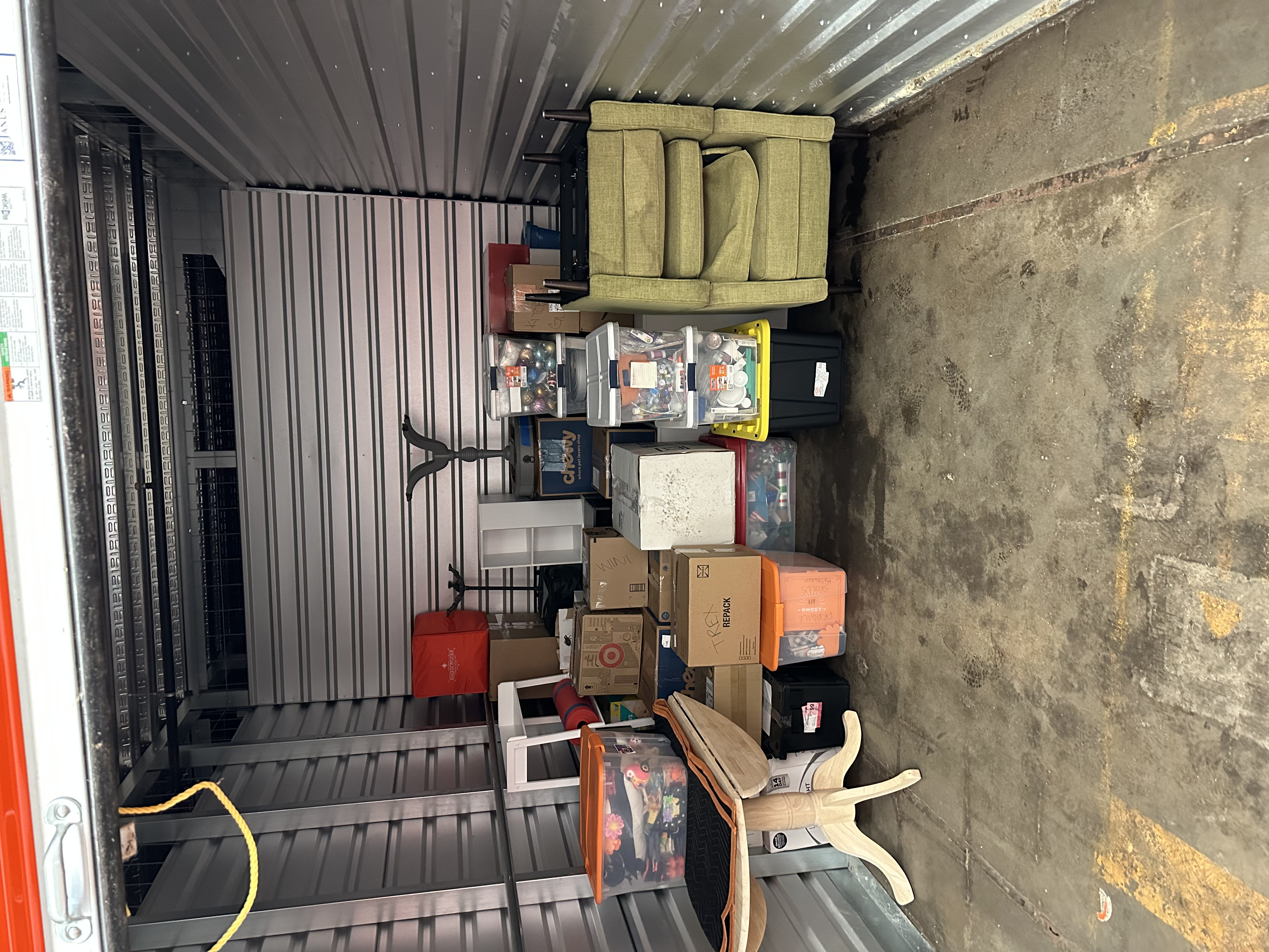 Storage unit loaded with wrapped furniture