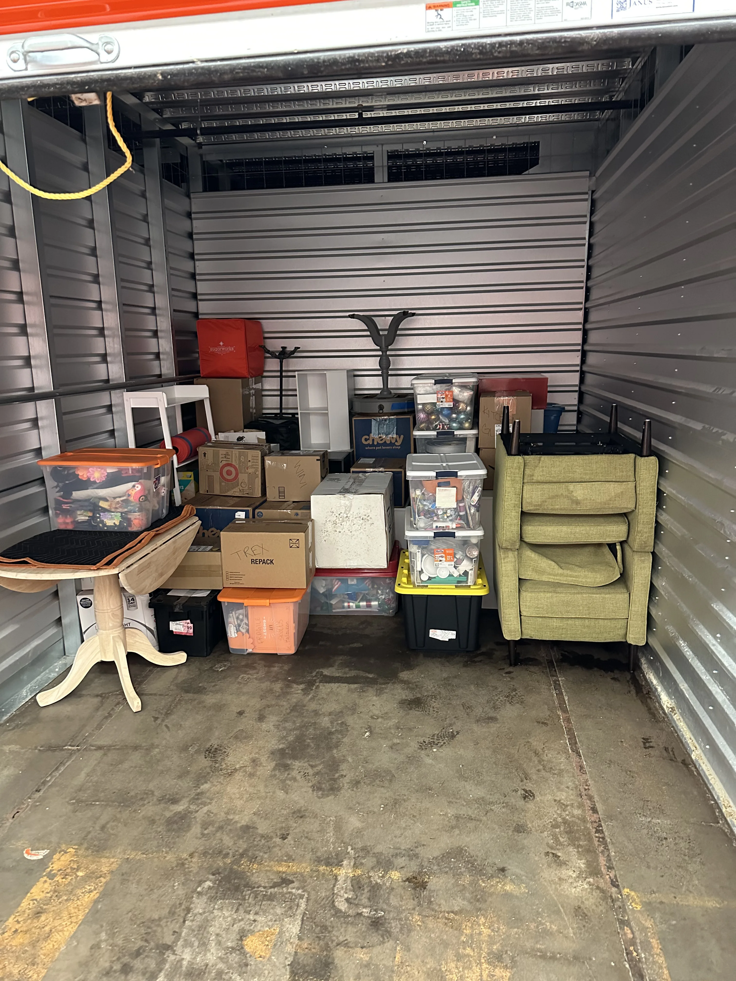 Storage unit loaded with wrapped furniture