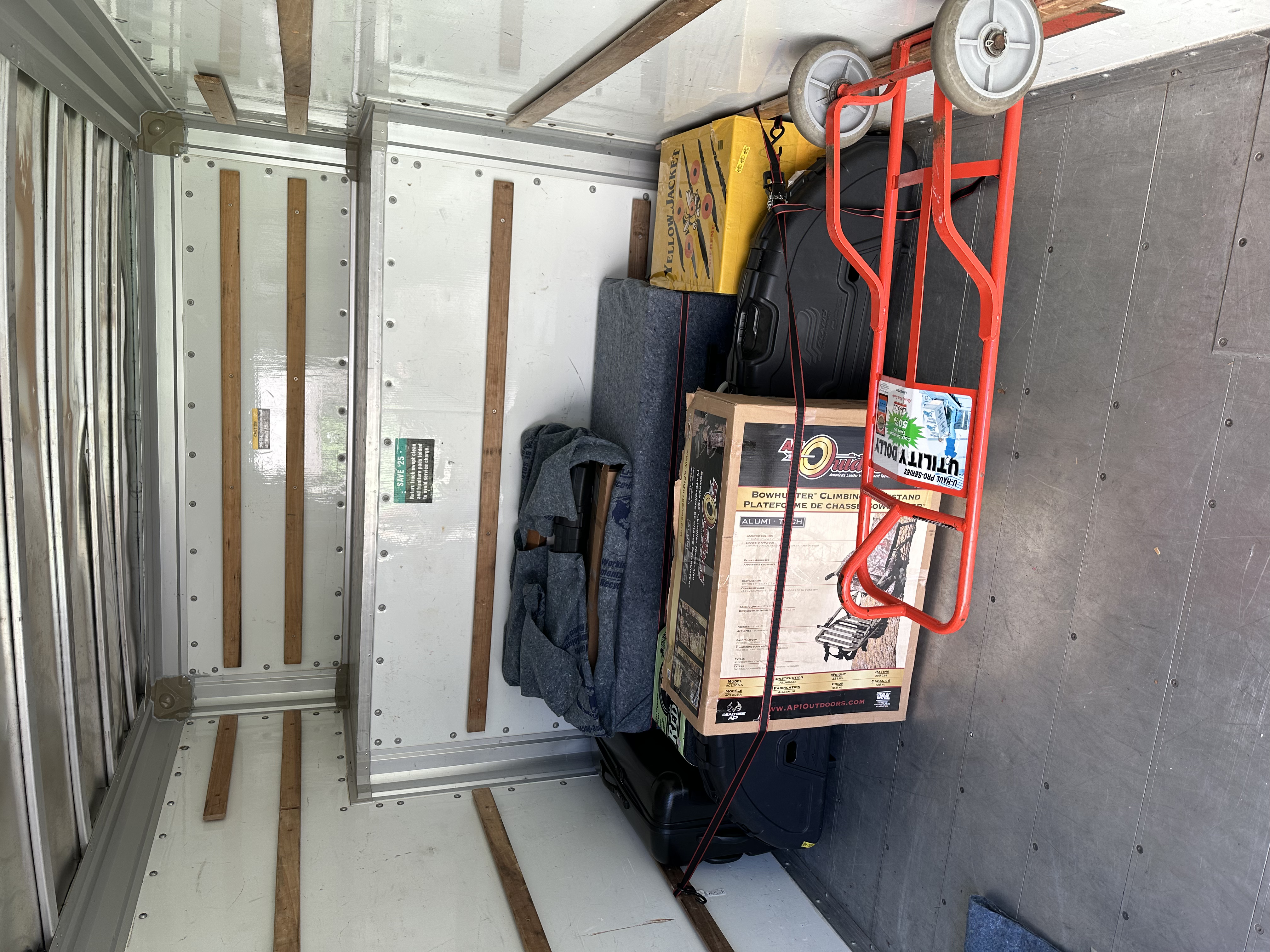 Gun safe loaded carefully on moving pad