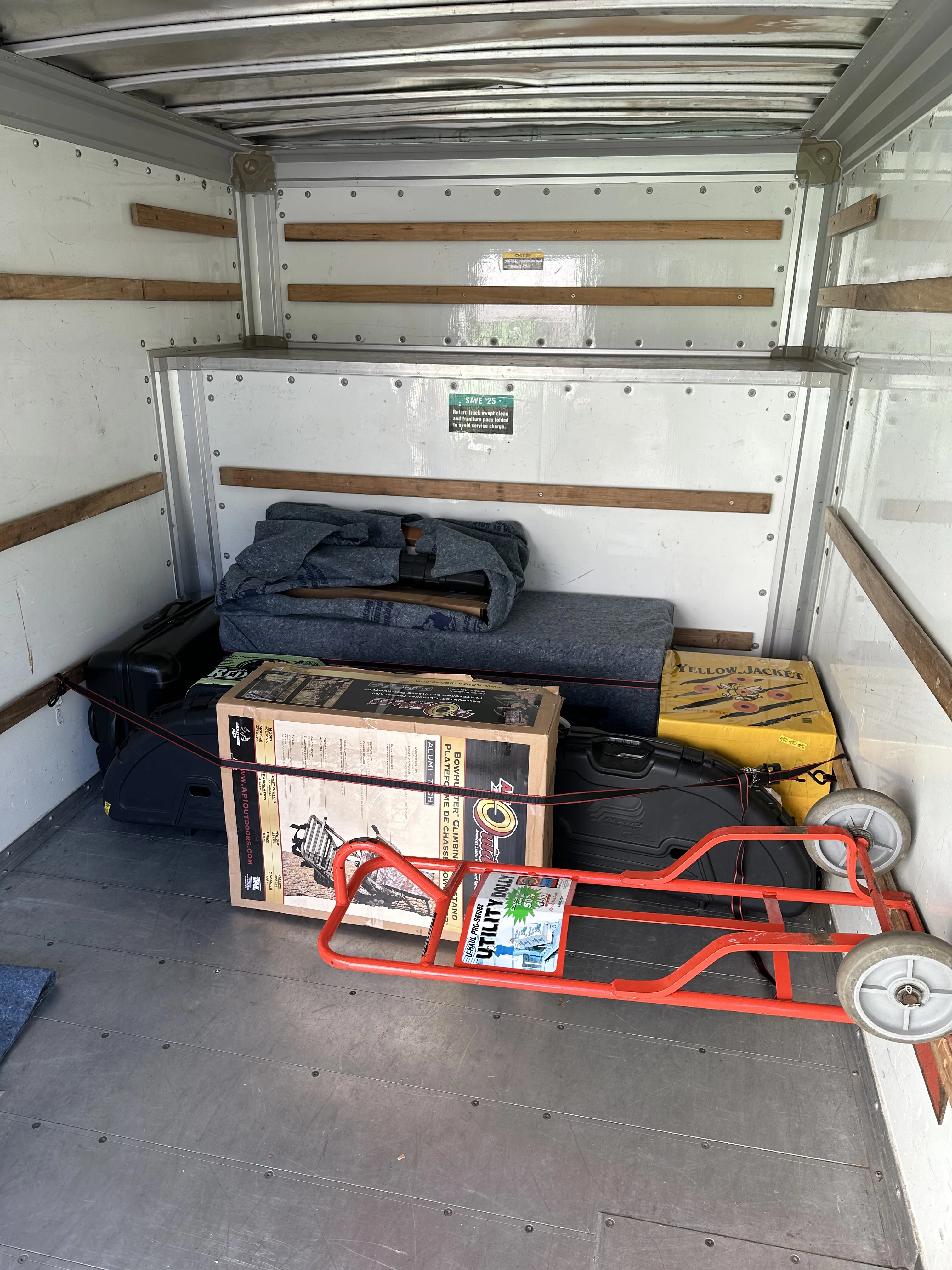 Gun safe loaded carefully on moving pad