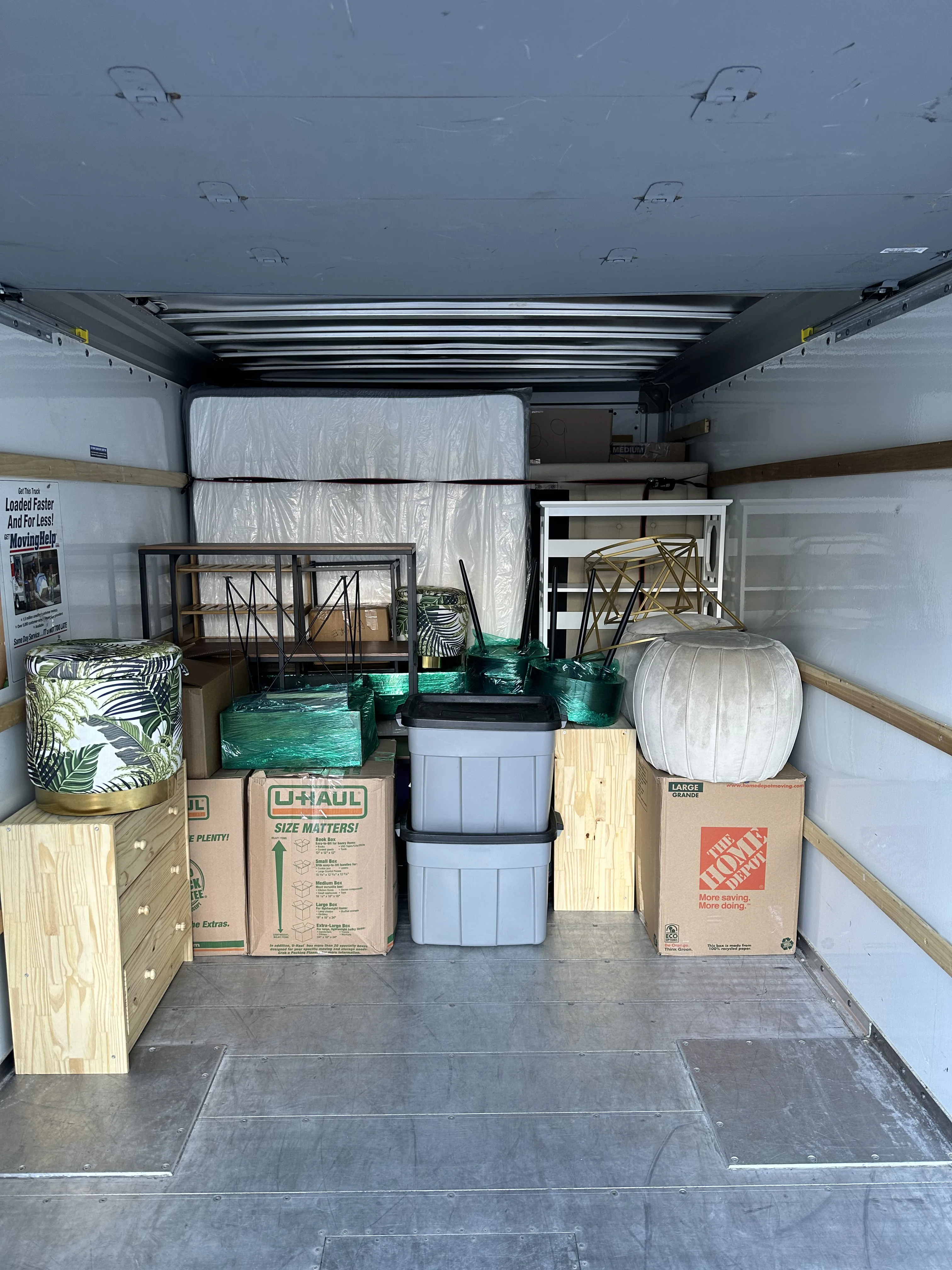 Organized truck interior with mattress and shelving