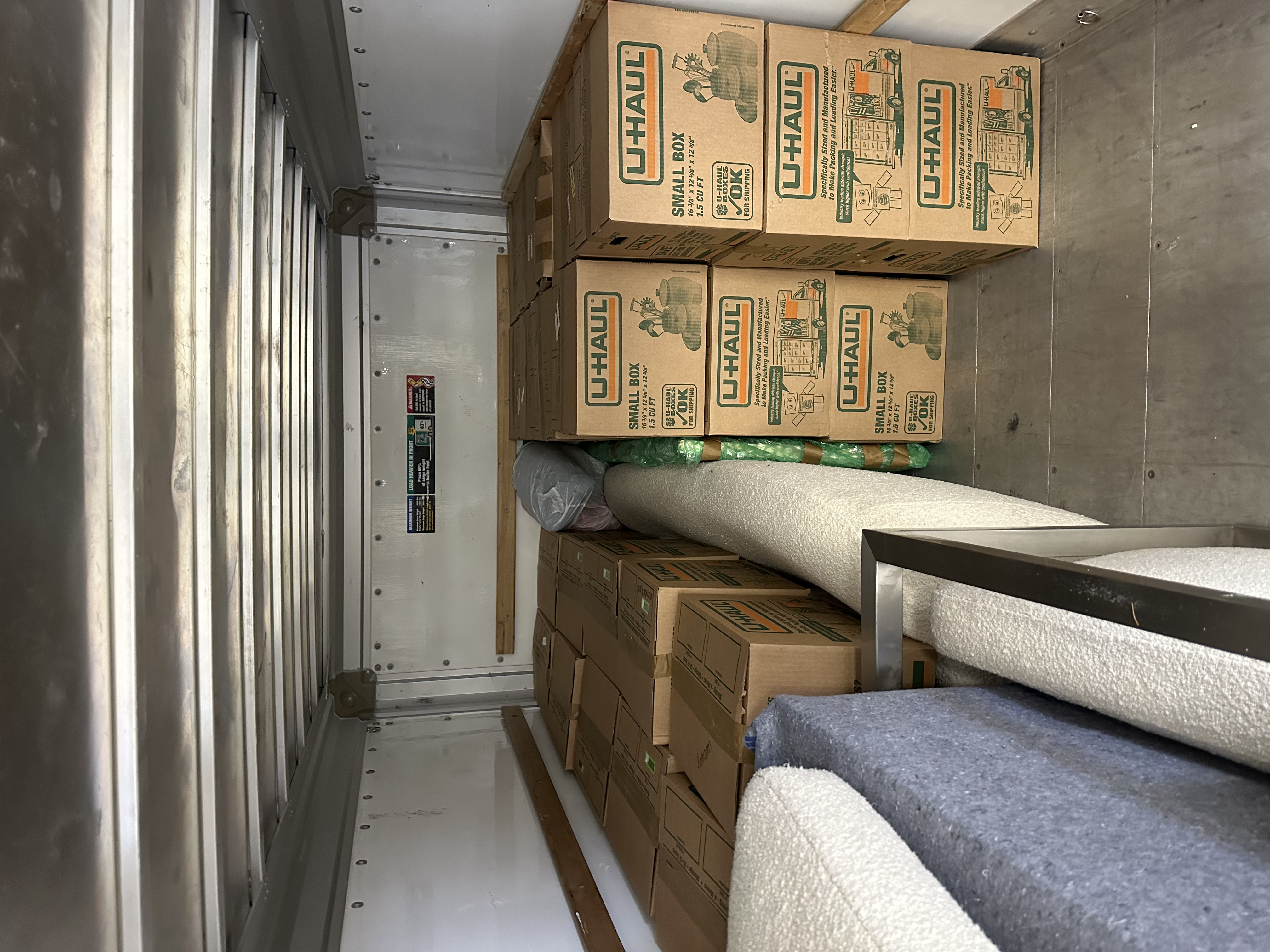 Boxes and totes loaded into truck interior