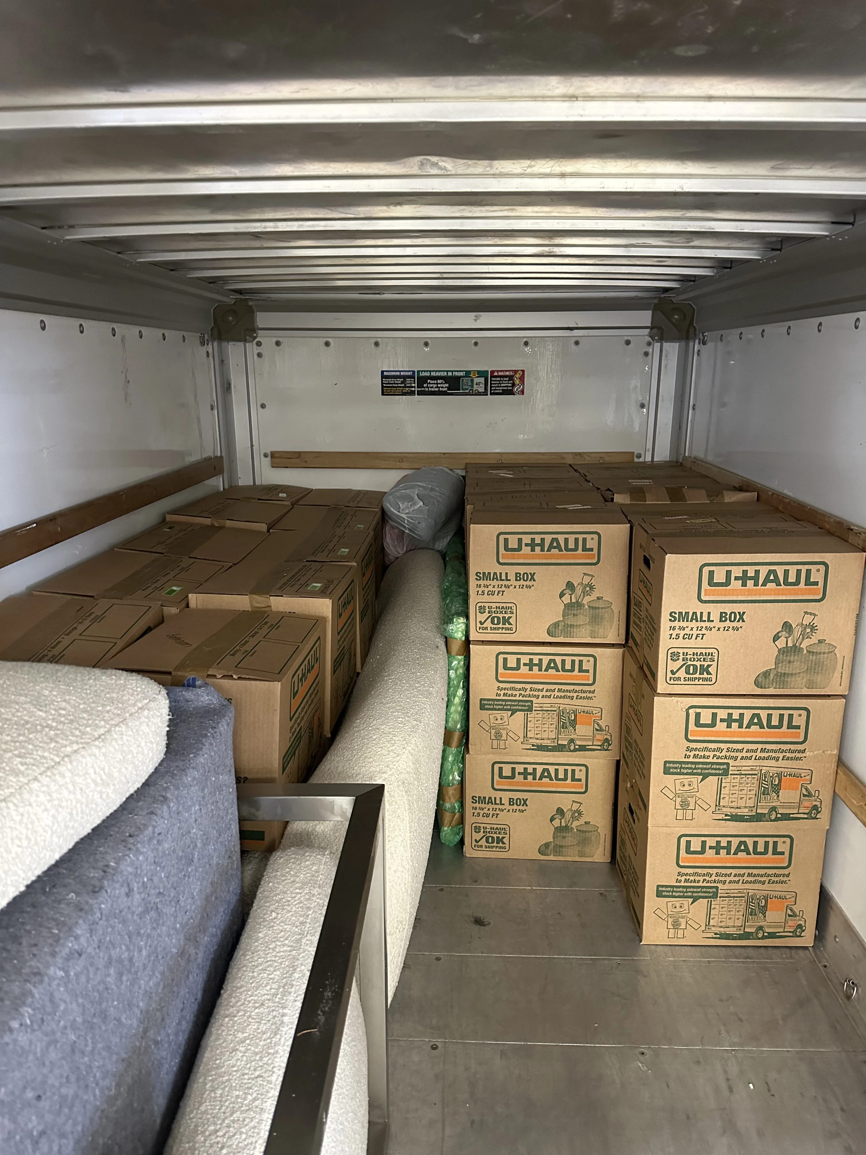 Boxes and totes loaded into truck interior