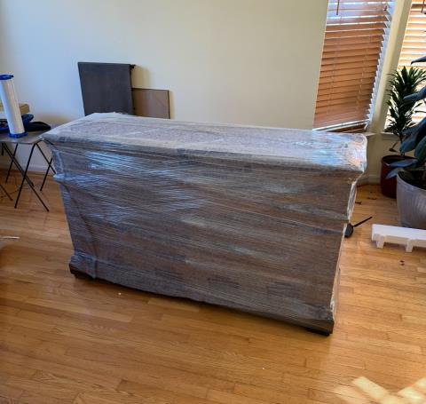 Loaded truck — green wrap and furniture