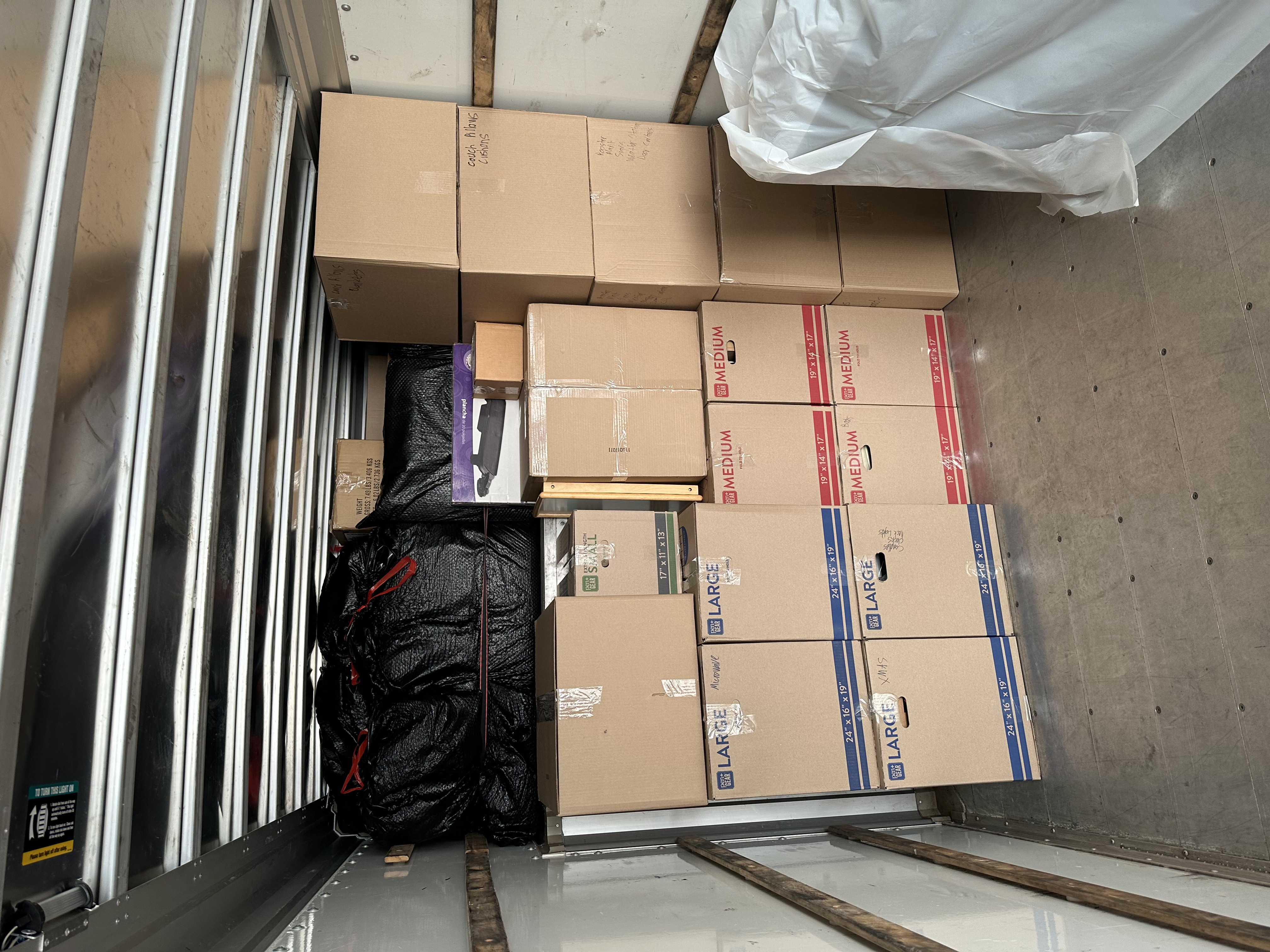 Boxes stacked from floor to ceiling