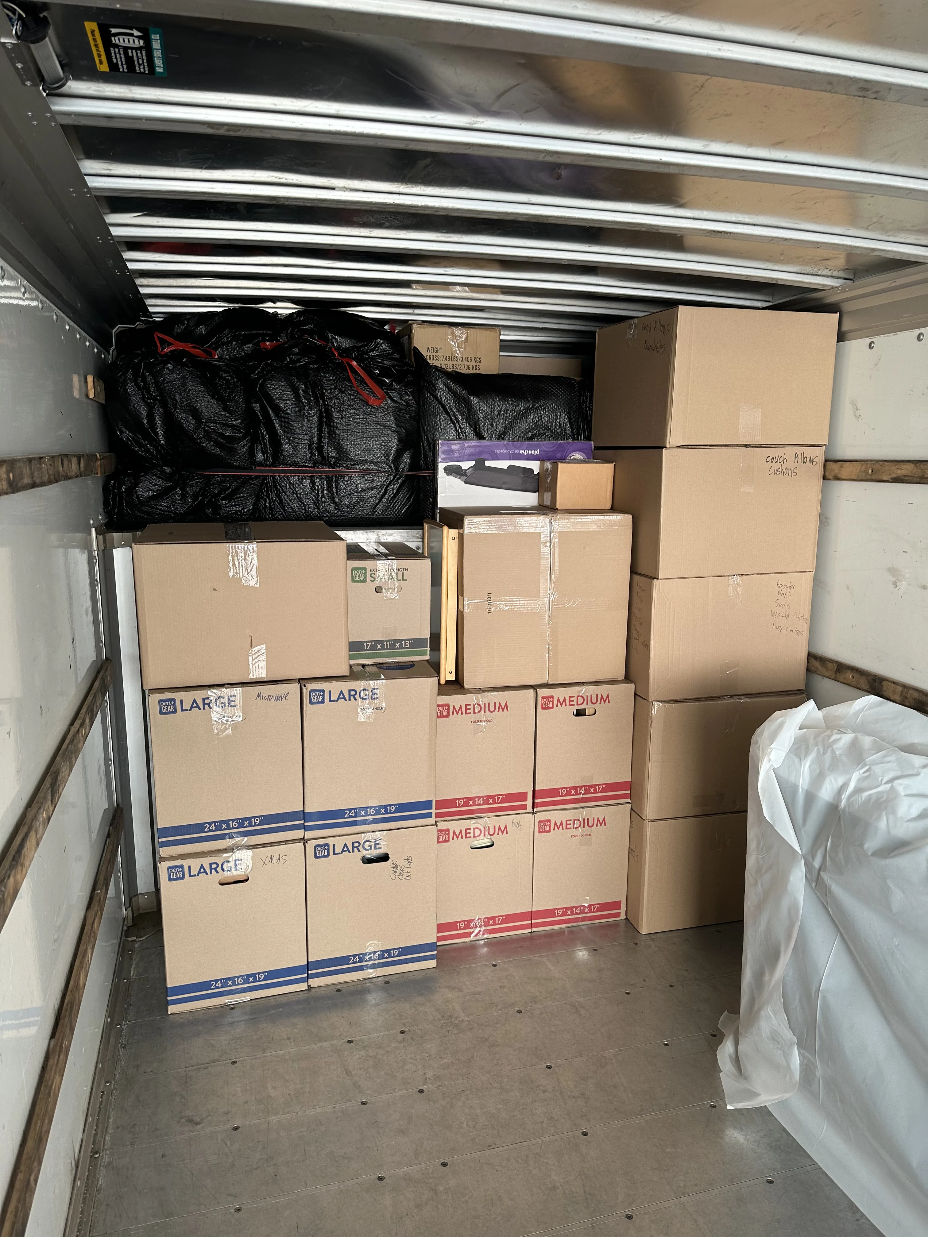 Boxes stacked from floor to ceiling