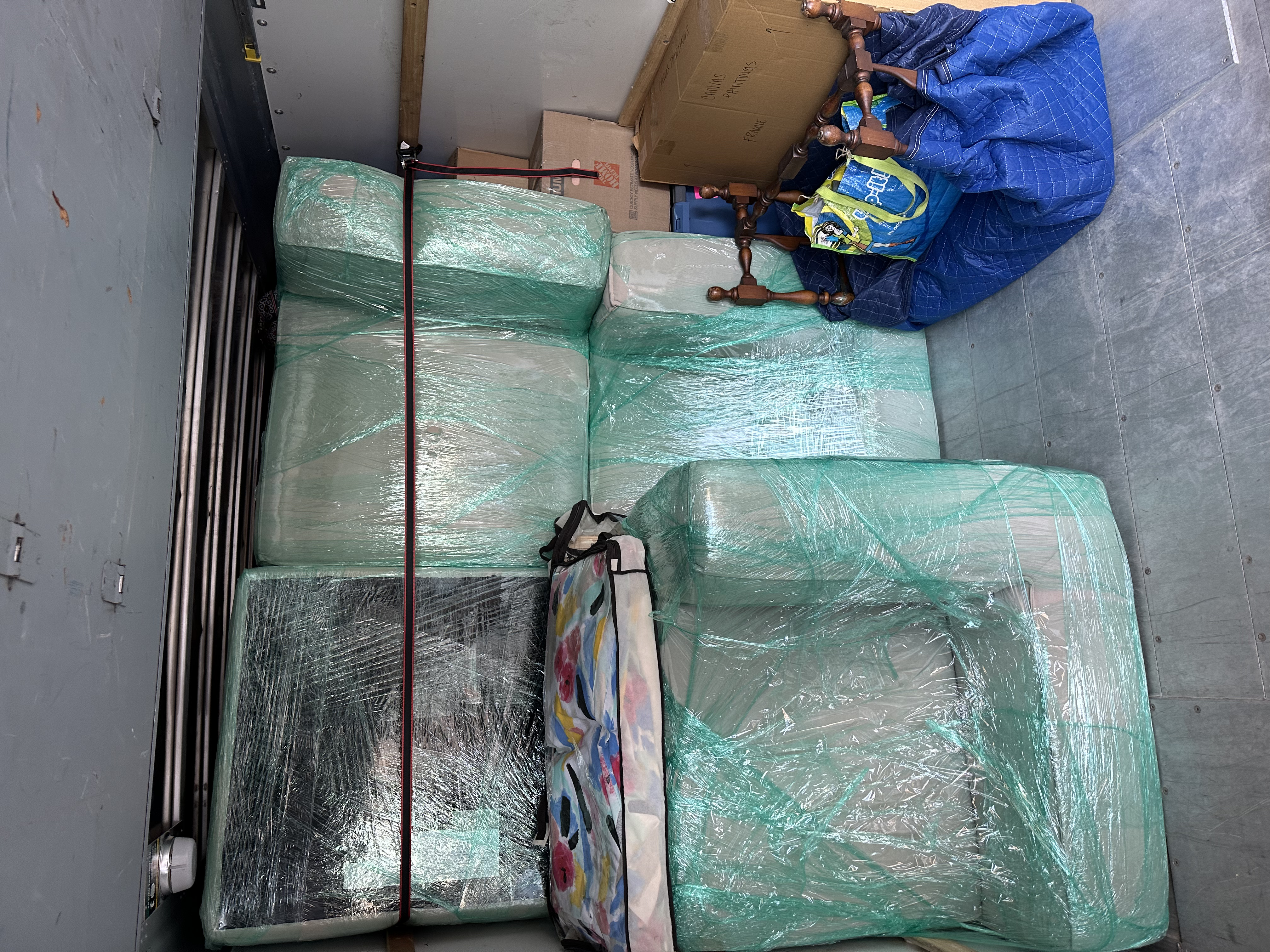 Furniture wrapped and strapped — full truck view