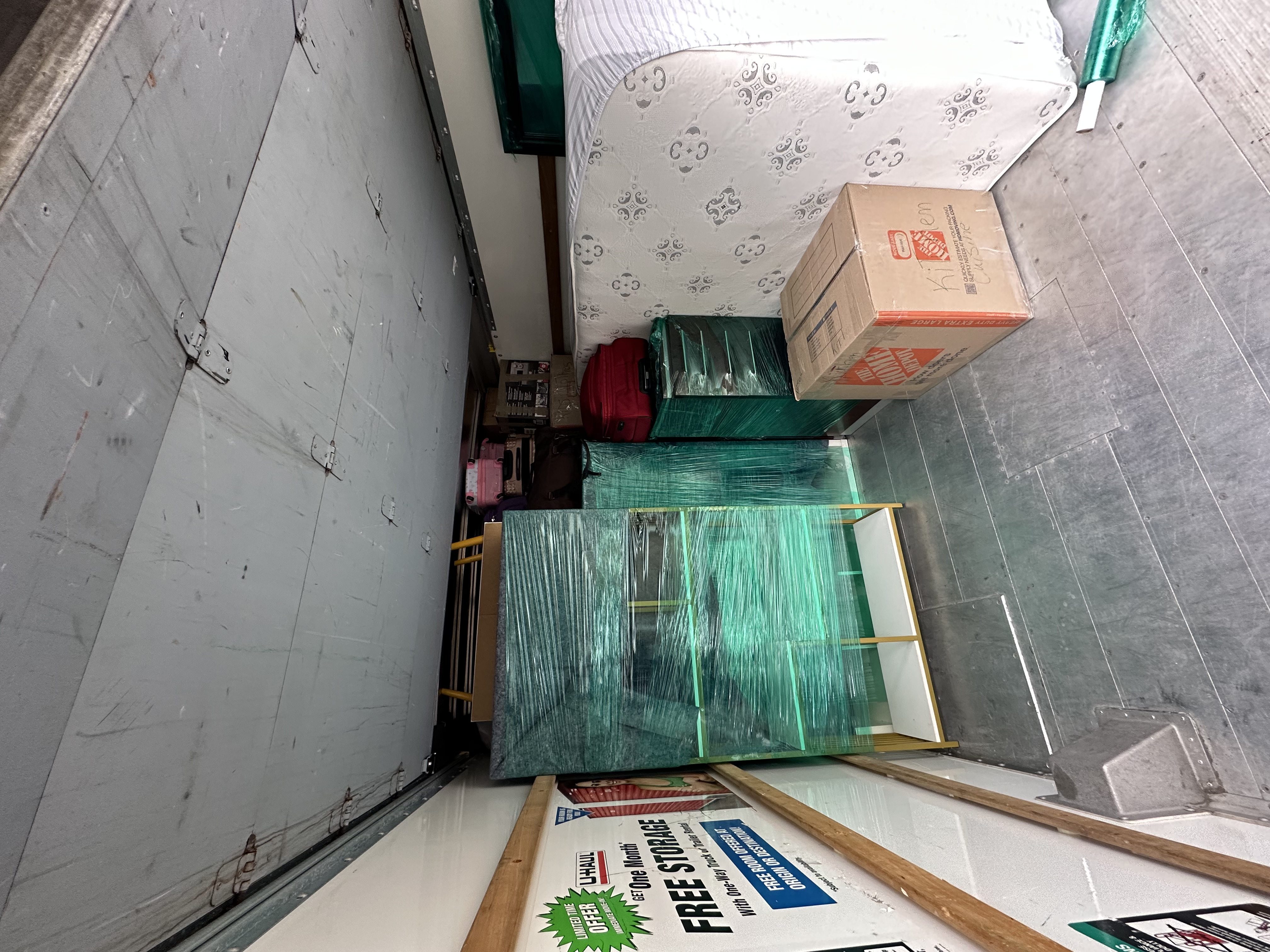 Truck interior with wrapped furniture and appliances