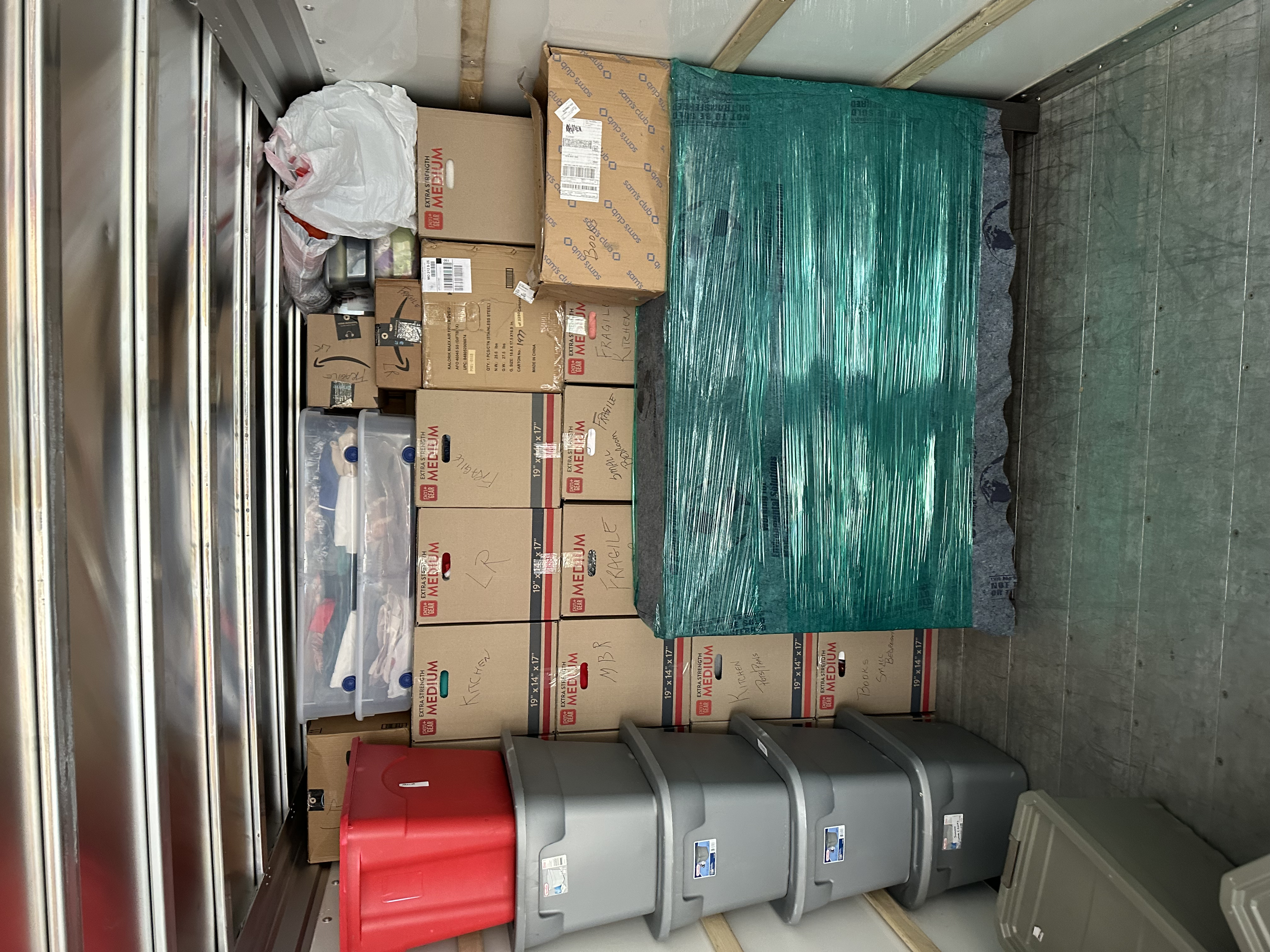 Truck interior with totes and medium boxes organized