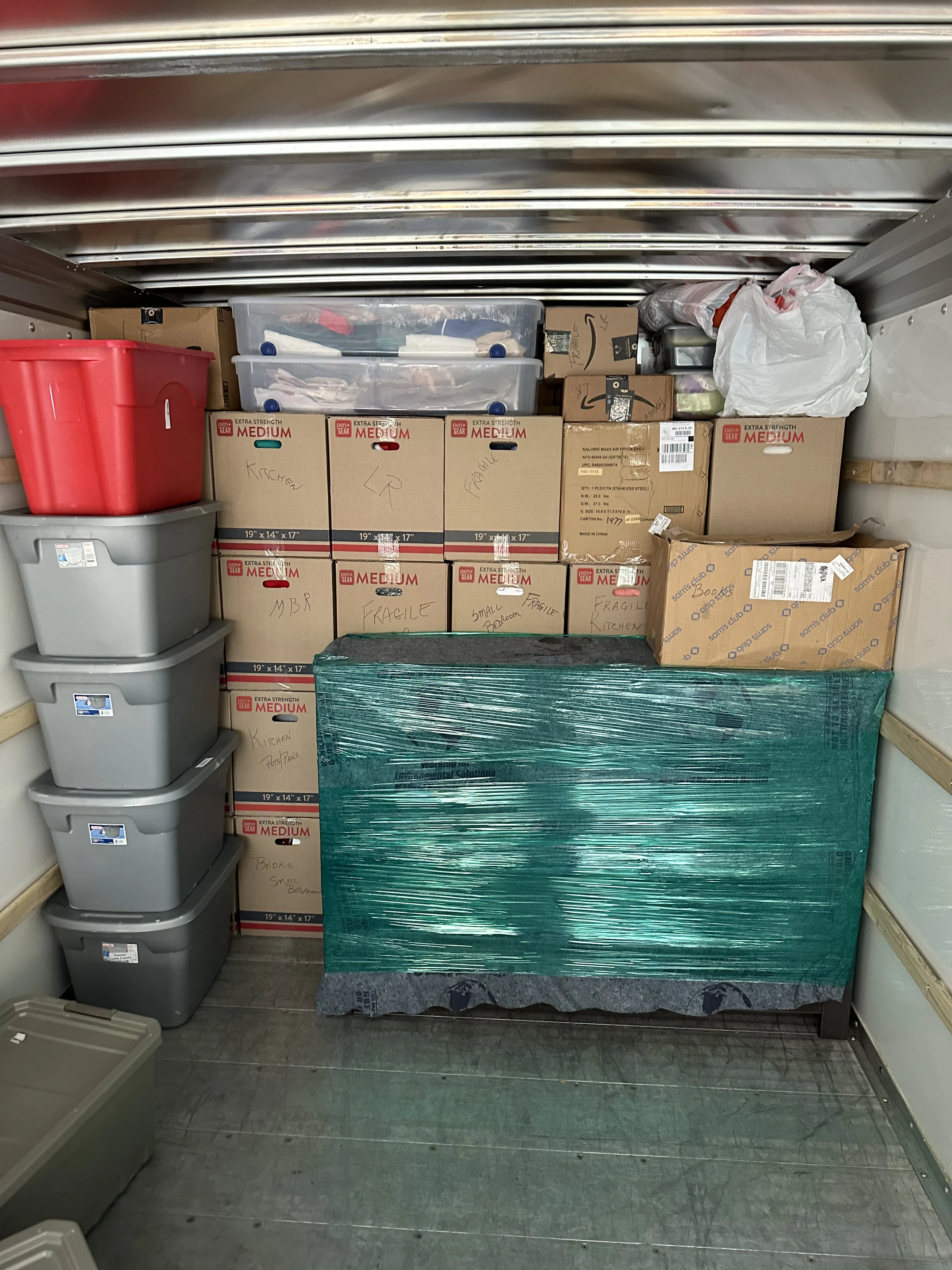 Truck interior with totes and medium boxes organized