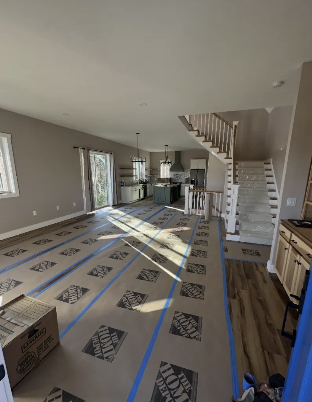 Floor protection laid down before move-in begins